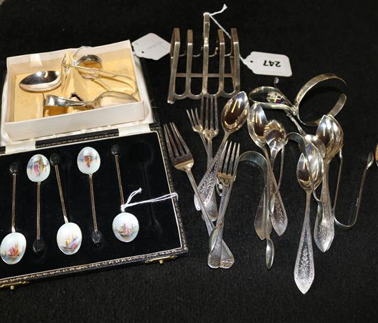 Part set enamelled silver coffee spoons, sundry silver spoons, tongs, forks, pushers etc & a small toast rack